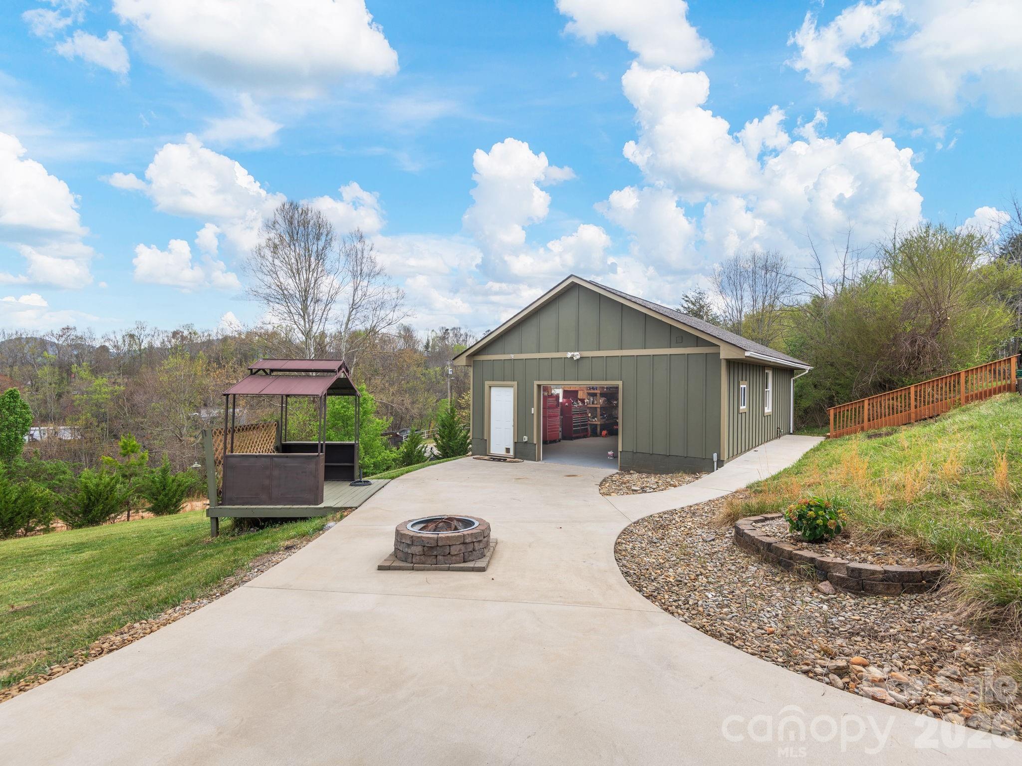 193 Youngs Cove Road Candler, NC 28715 - Photo 41 of 48 a view of a house with a yard