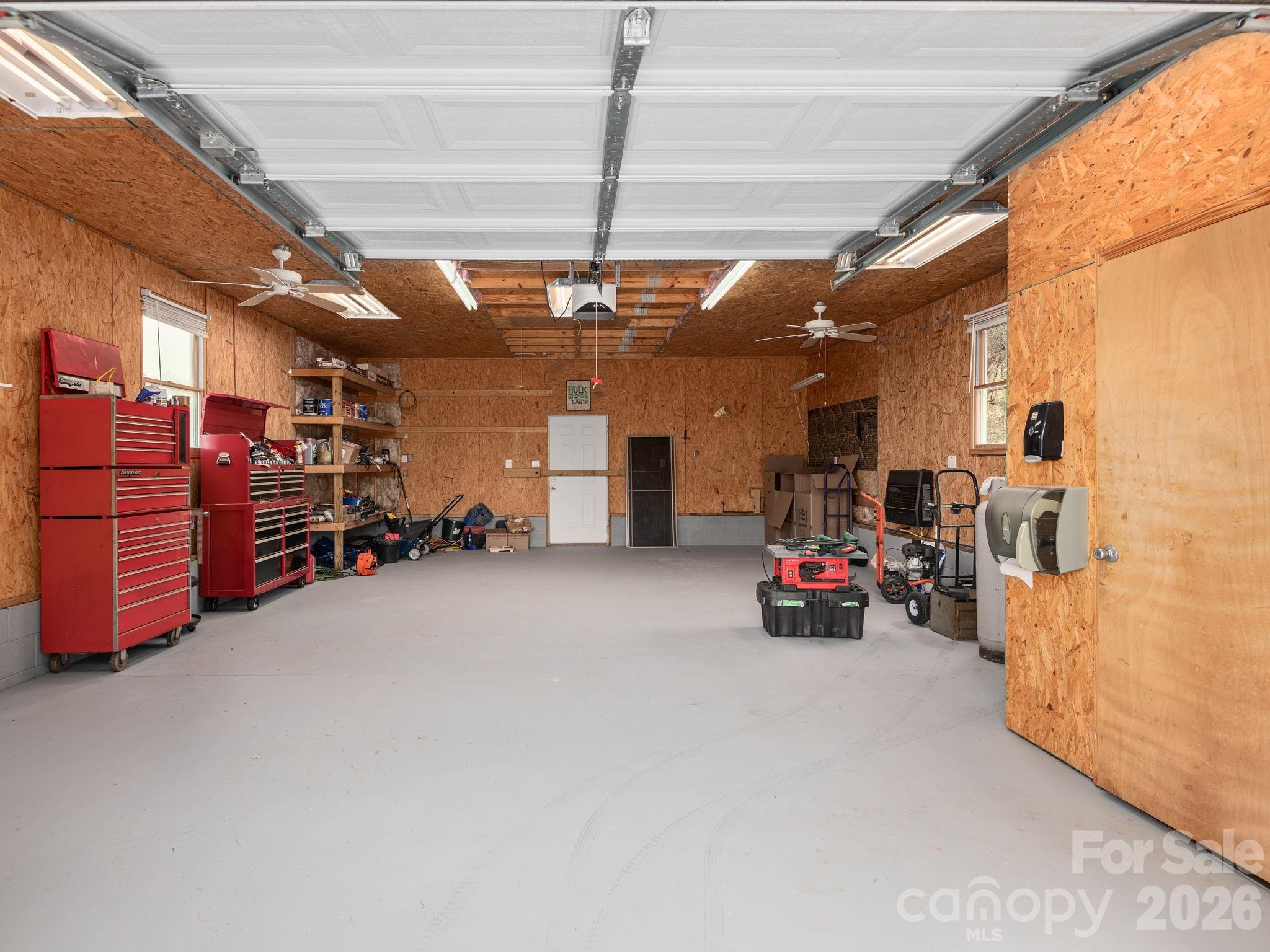 193 Youngs Cove Road Candler, NC 28715 - Photo 42 of 48 a view of a garage with storage