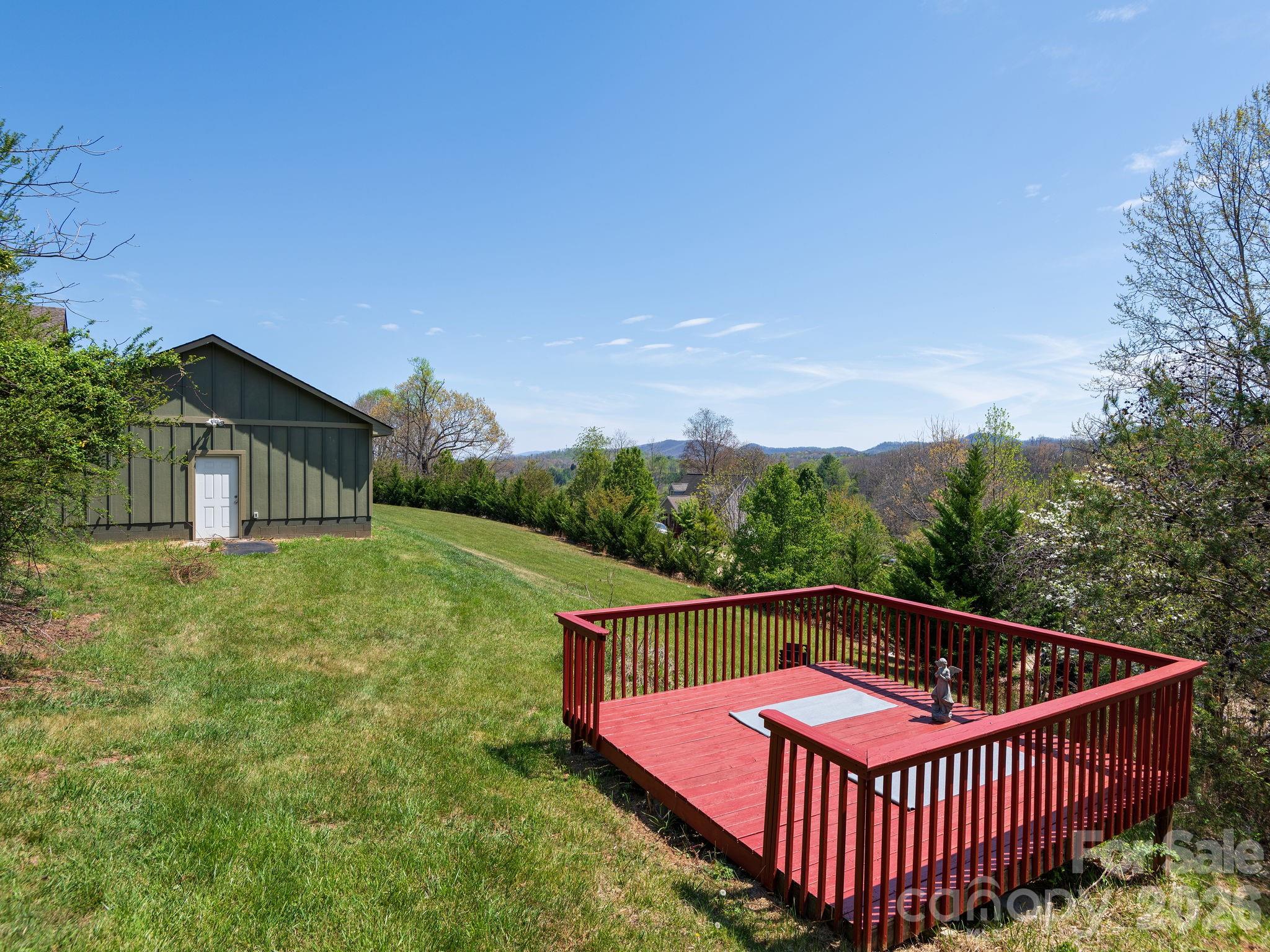 193 Youngs Cove Road Candler, NC 28715 - Photo 43 of 48 a view of a backyard with sitting area