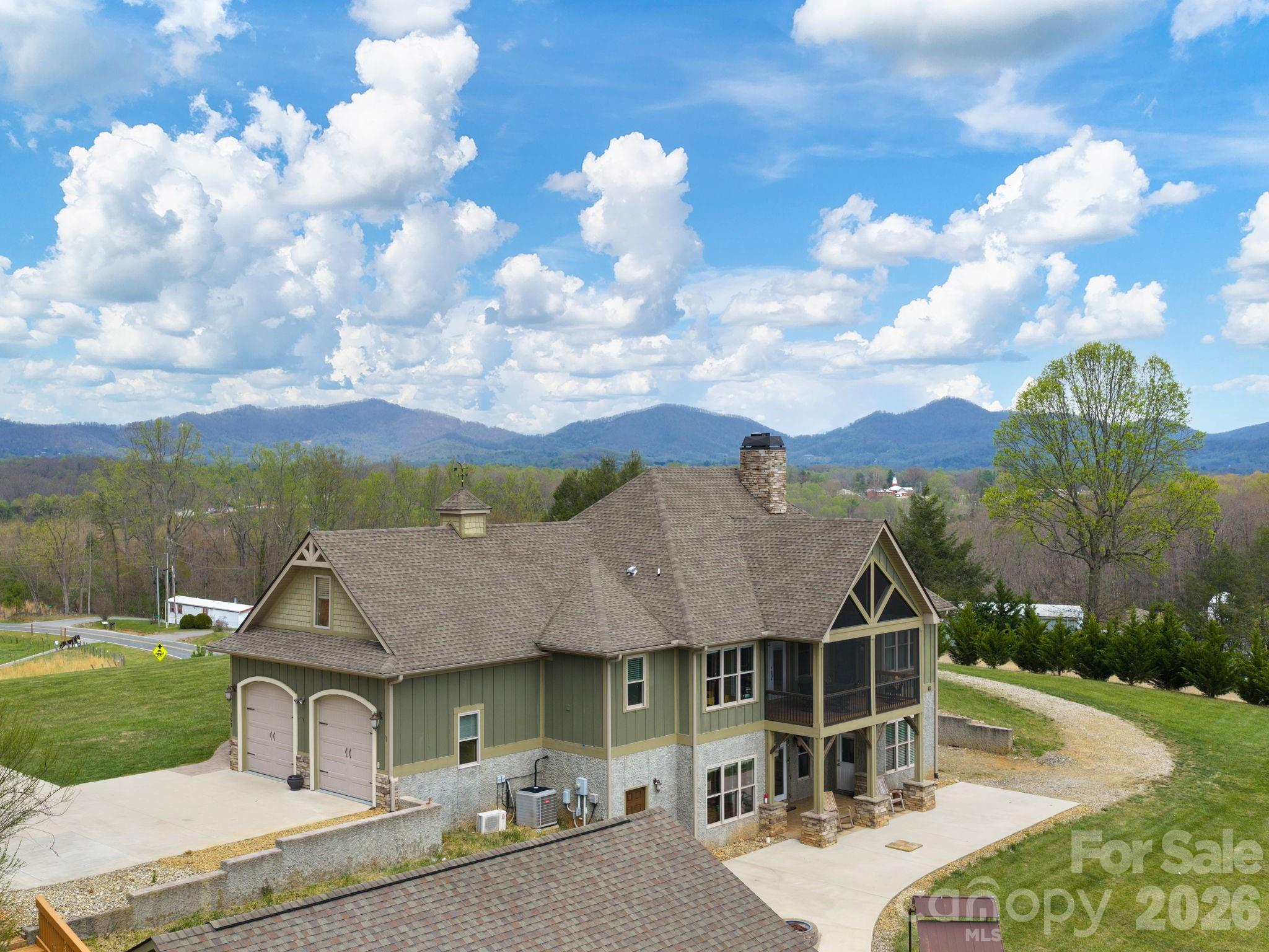 193 Youngs Cove Road Candler, NC 28715 - Photo 44 of 48 a front view of a house with garden