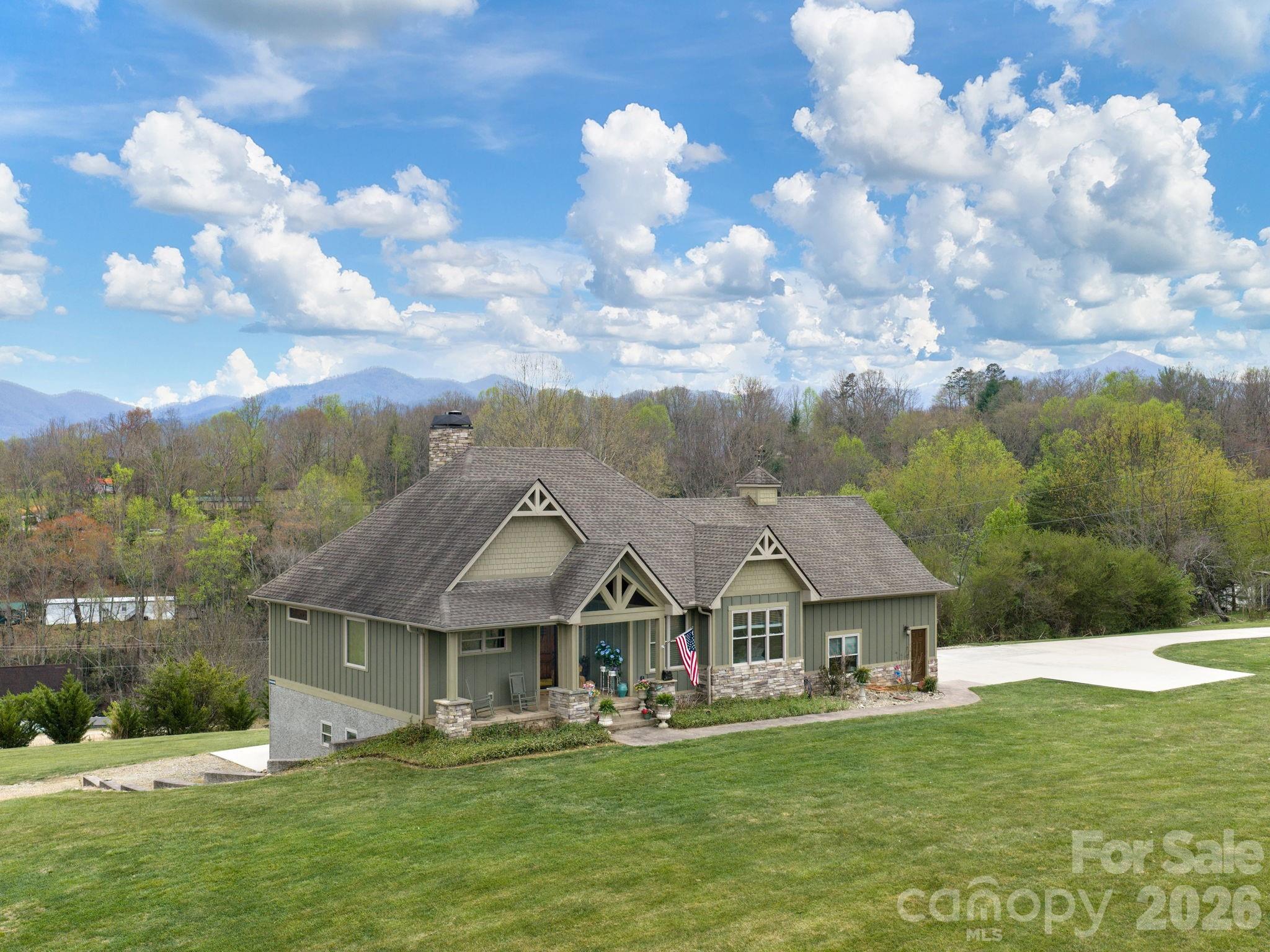 193 Youngs Cove Road Candler, NC 28715 - Photo 48 of 48 a front view of house with yard and green space