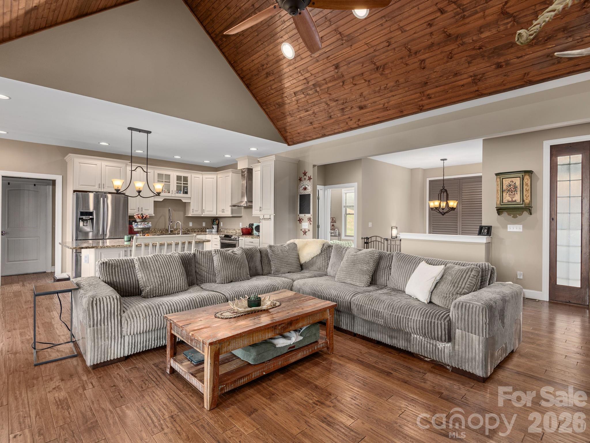 193 Youngs Cove Road Candler, NC 28715 - Photo 6 of 48 a living room with furniture and a wooden floor