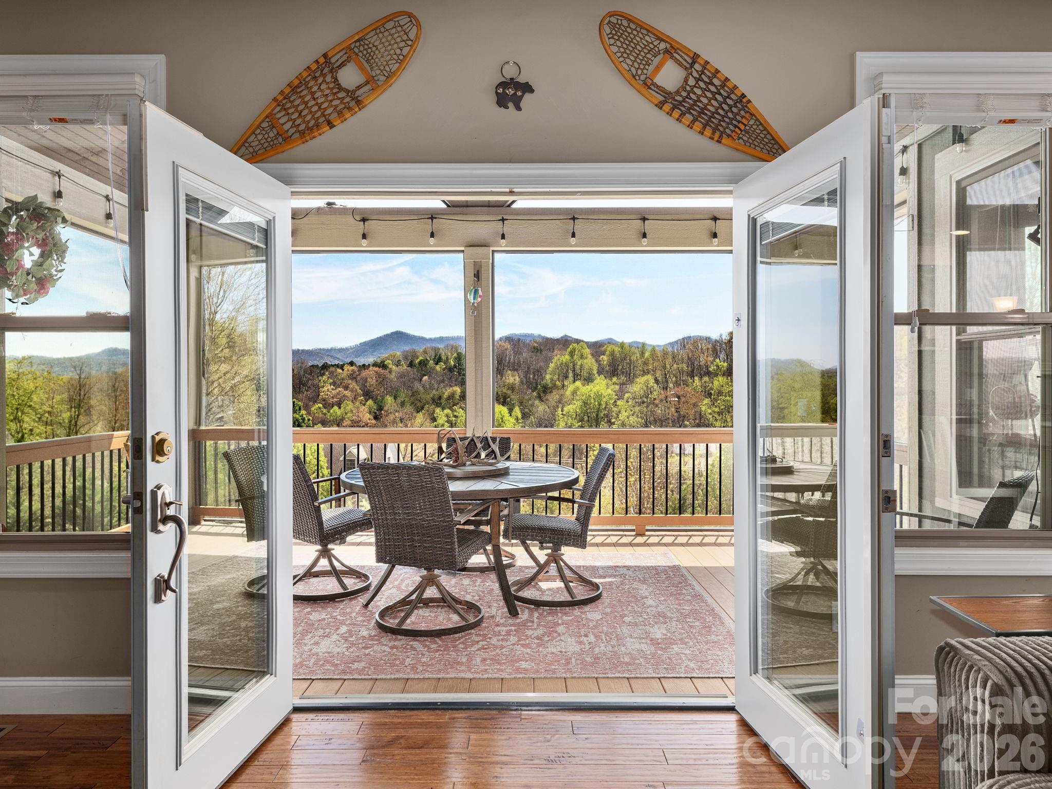 193 Youngs Cove Road Candler, NC 28715 - Photo 8 of 48 a view of a dining room with furniture window and outside view