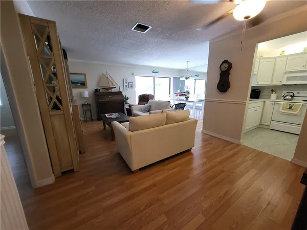 a kitchen with appliances a sink and cabinets