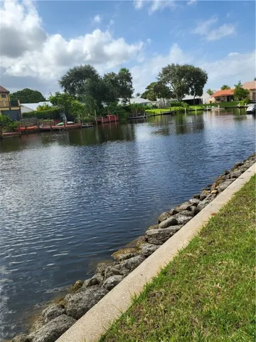 a view of a chairs and table in a balcony