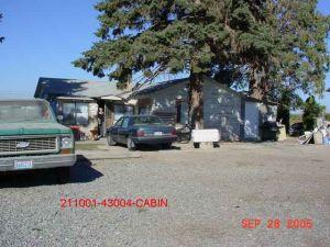 2651 Gurley Road Granger, WA 98932 - Photo 1 of 1 a street view with parking and sign board