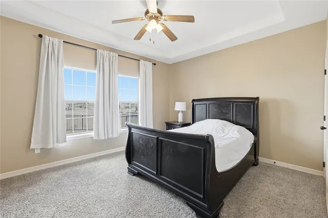 a bed sitting in a room next to a window