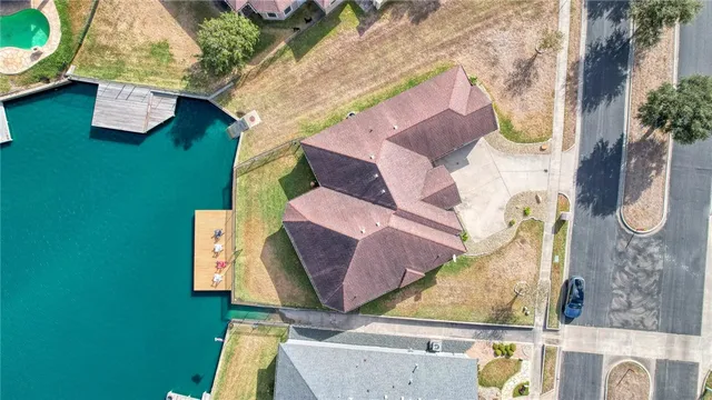 an aerial view of a house with swimming pool