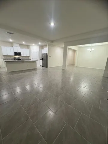 a view of a kitchen with a sink and cabinets