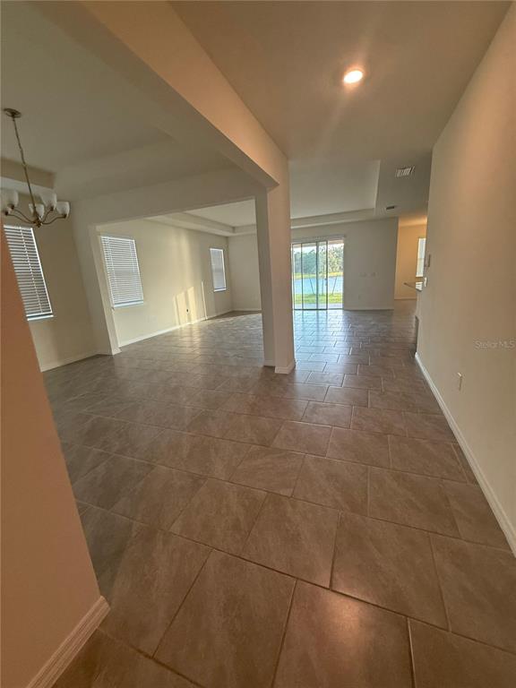 1729 Bull Hill Road Kissimmee, FL 34744 - Photo 11 of 34 a view of a big room with windows and cabinet