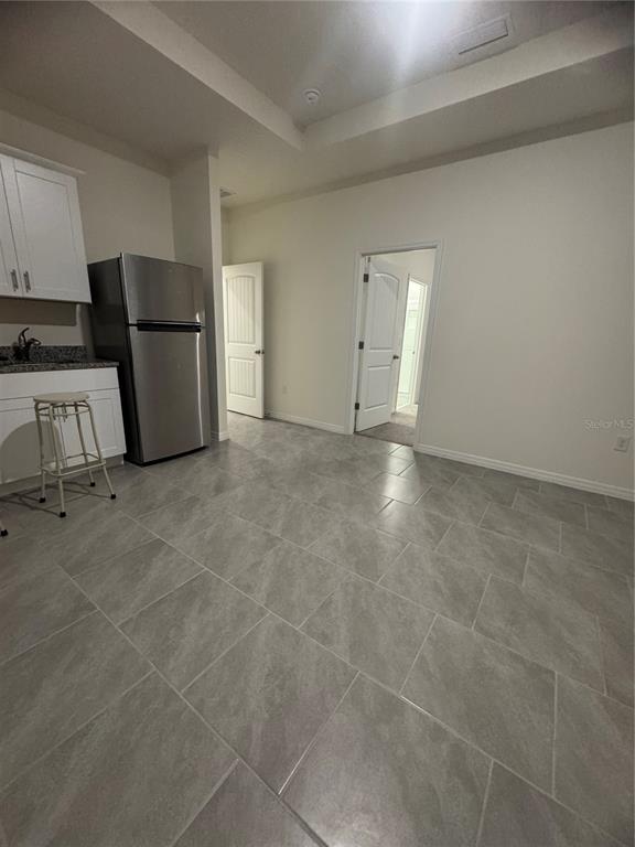 1729 Bull Hill Road Kissimmee, FL 34744 - Photo 13 of 34 a view of a refrigerator and window in a kitchen