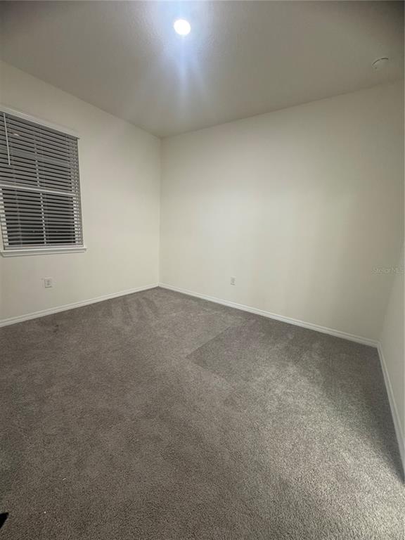 1729 Bull Hill Road Kissimmee, FL 34744 - Photo 20 of 34 an empty room with a window