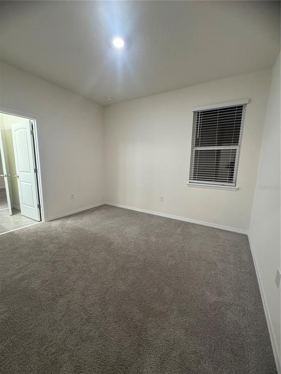1729 Bull Hill Road Kissimmee, FL 34744 - Photo 21 of 34 an empty room with a window