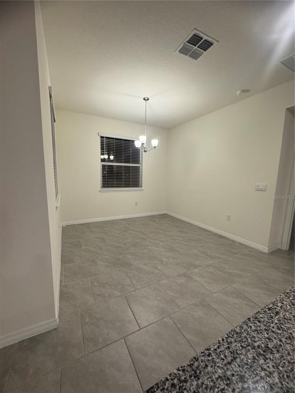 1729 Bull Hill Road Kissimmee, FL 34744 - Photo 24 of 34 an empty room with projector and bathroom