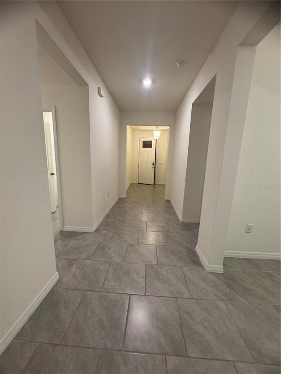 1729 Bull Hill Road Kissimmee, FL 34744 - Photo 7 of 34 a view of a hallway to rooms