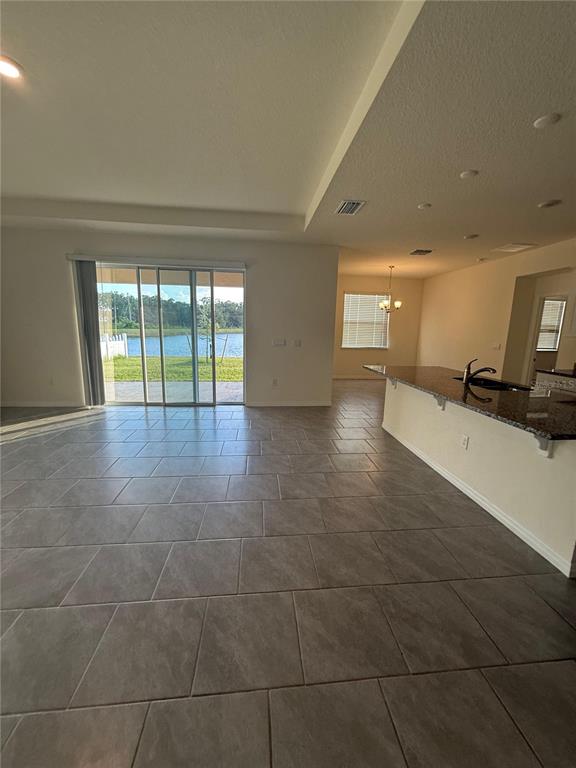 1729 Bull Hill Road Kissimmee, FL 34744 - Photo 8 of 34 a view of an empty room with a window