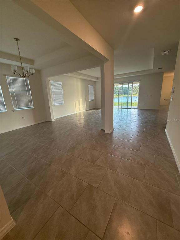 1729 Bull Hill Road Kissimmee, FL 34744 - Photo 9 of 34 a view of a room with window and wooden floor