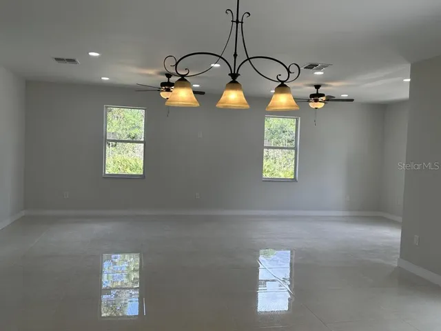 a view of a hallway with windows