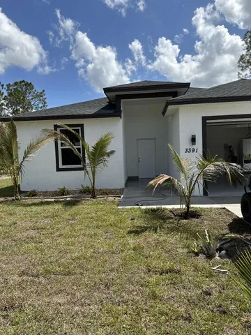 a house view with a backyard space