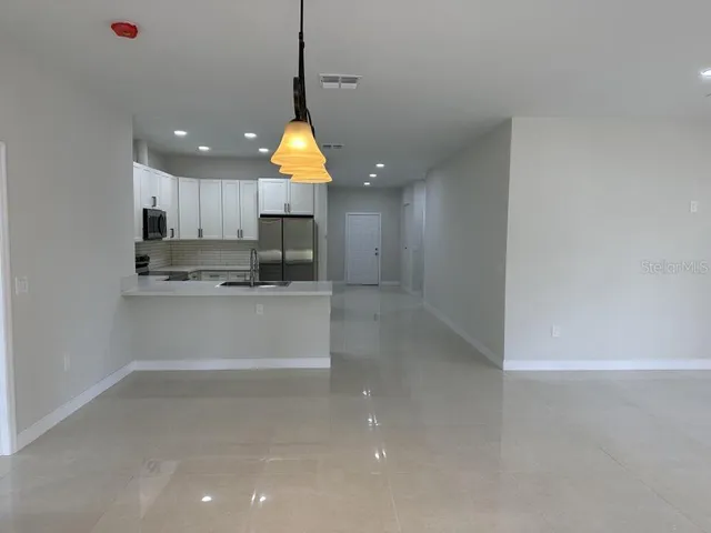 a view of a kitchen and window