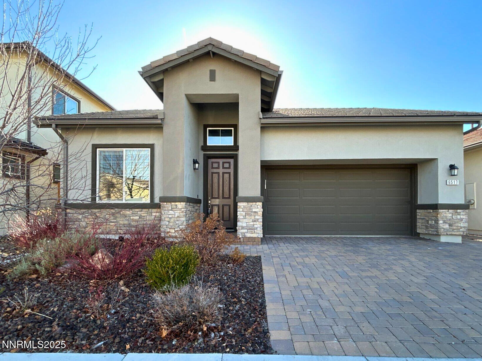 6517 Angels Orchard Drive Sparks, NV 89436 - Photo 1 of 20 a front view of a house with garden