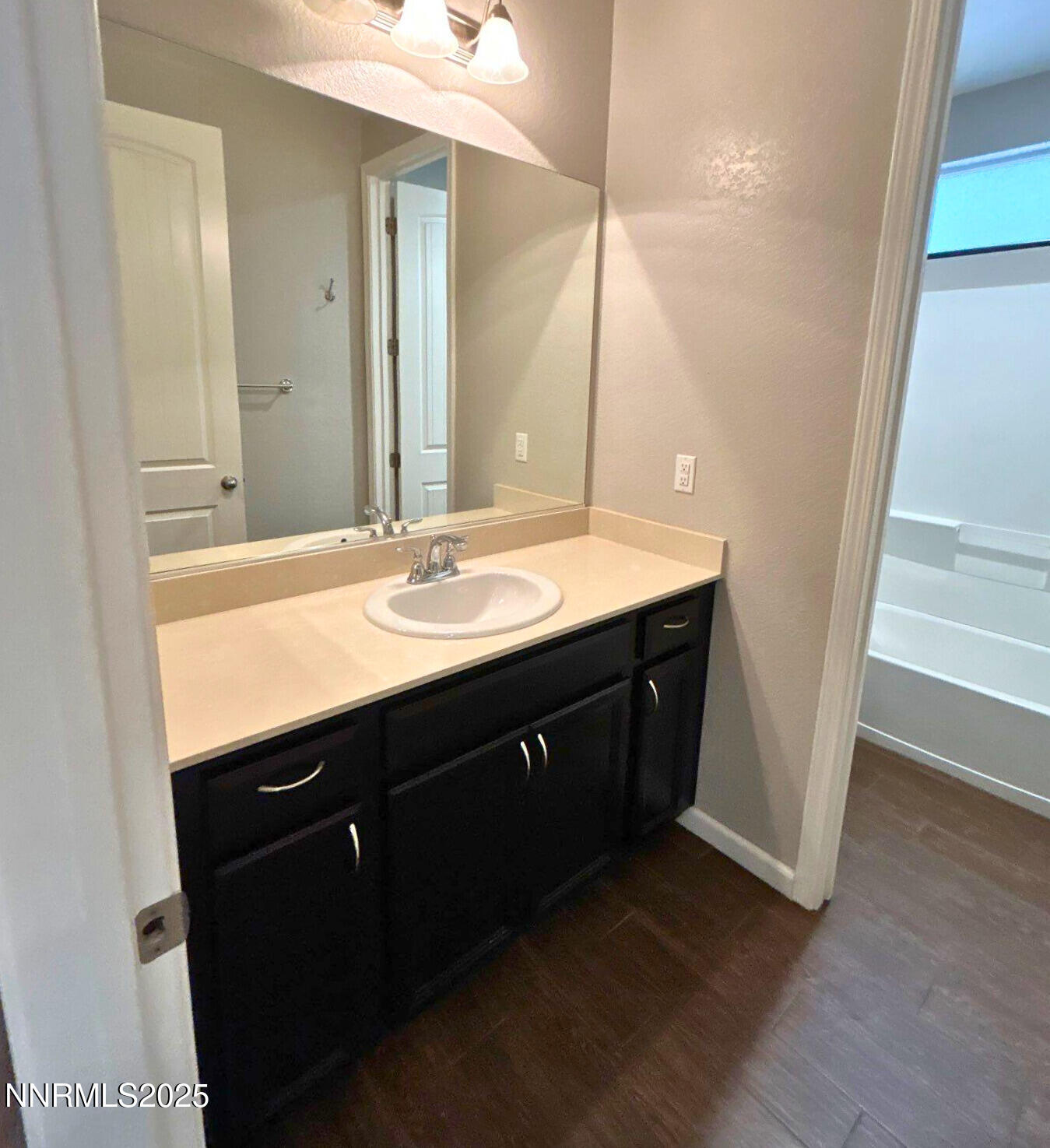 6517 Angels Orchard Drive Sparks, NV 89436 - Photo 14 of 20 a bathroom with a sink and a mirror