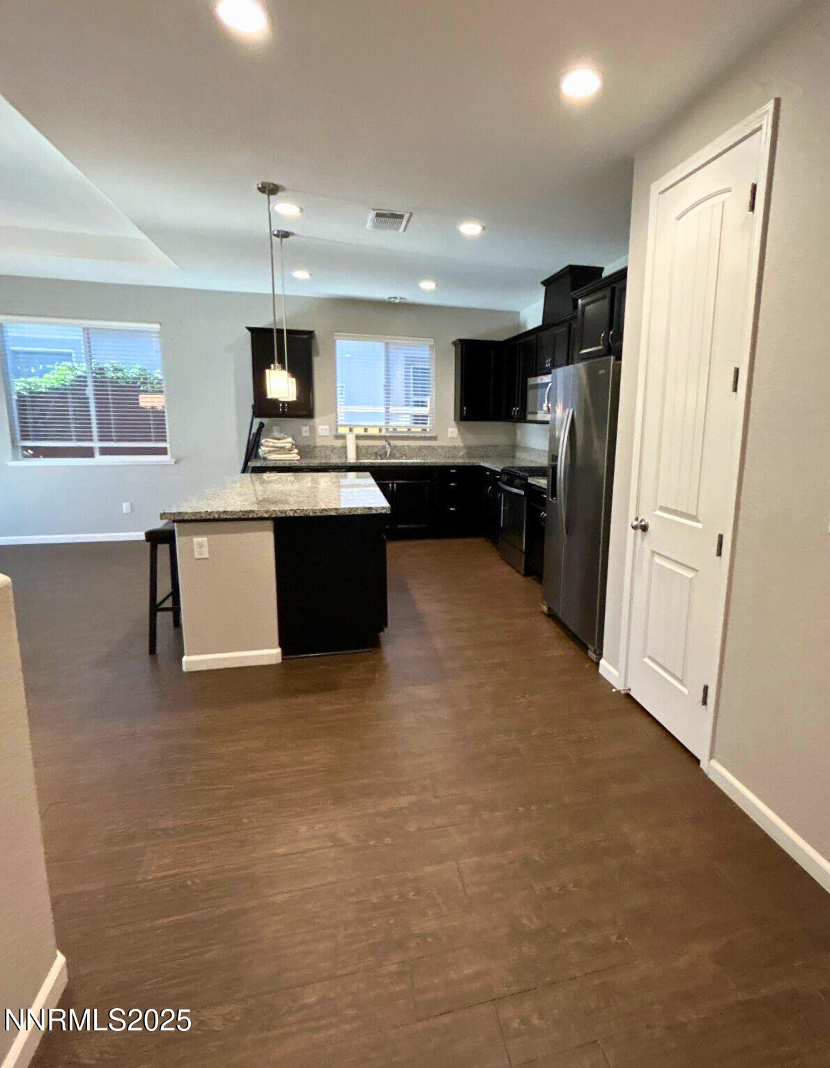 6517 Angels Orchard Drive Sparks, NV 89436 - Photo 2 of 20 a large kitchen with stainless steel appliances granite countertop a refrigerator and a sink