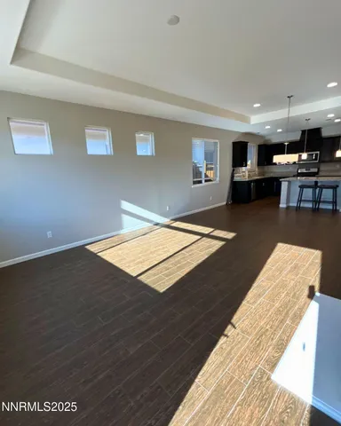 a living room with kitchen island furniture and a wooden floor