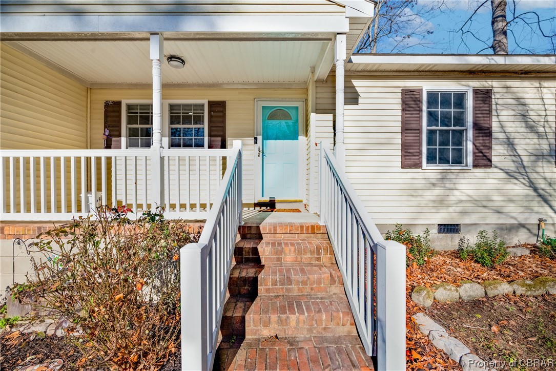 7635 Forbes Road Gloucester, VA 23061 - Photo 4 of 45 View of exterior entry featuring covered porch