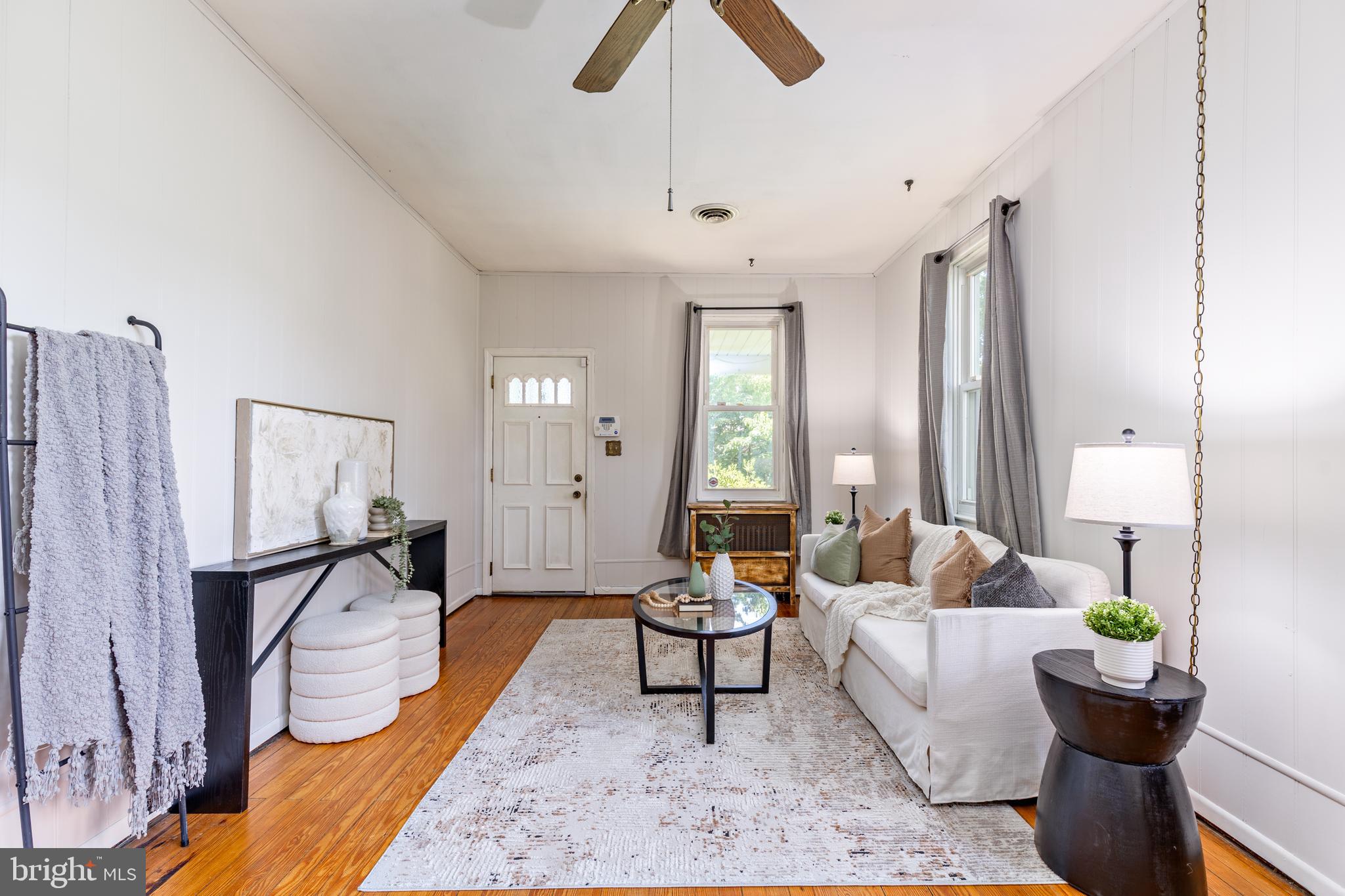 6426 Sherwood Road Baltimore, MD 21239 - Photo 4 of 43 a living room with furniture and wooden floor