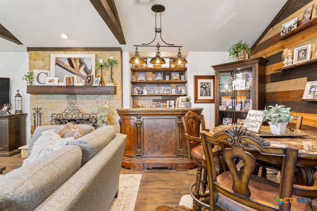 6409 3 Forks Road Belton, TX 76513 - Photo 18 of 40 a living room with fireplace furniture and a flat screen tv