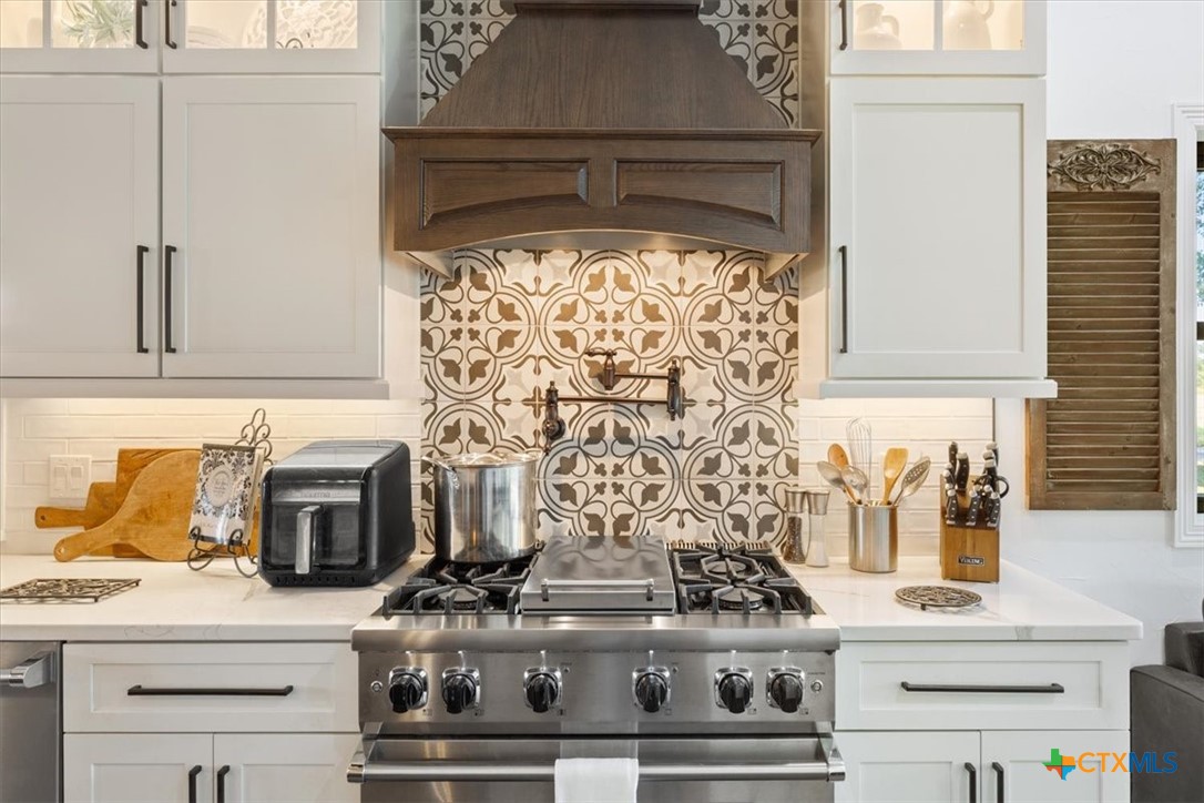 6409 3 Forks Road Belton, TX 76513 - Photo 22 of 40 a stove top oven sitting inside of a kitchen