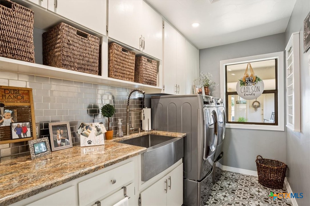 6409 3 Forks Road Belton, TX 76513 - Photo 24 of 40 a kitchen with stainless steel appliances granite countertop a refrigerator and a sink