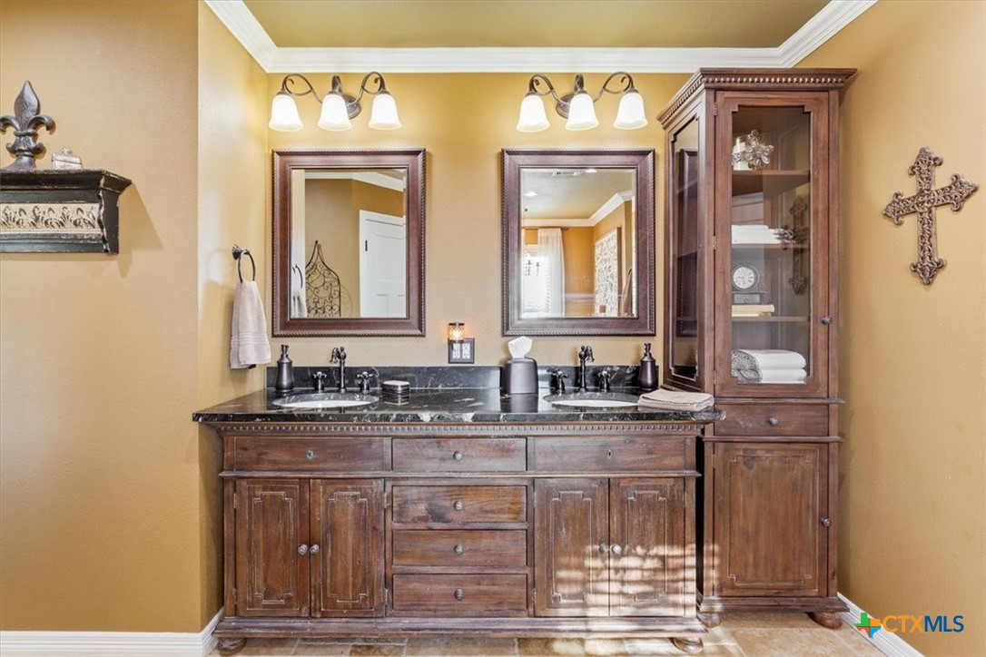 6409 3 Forks Road Belton, TX 76513 - Photo 27 of 40 a bathroom with a sink and a mirror