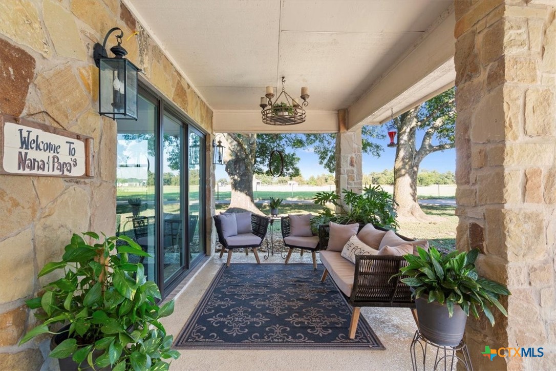 6409 3 Forks Road Belton, TX 76513 - Photo 34 of 40 a living room with furniture potted plant and a large window