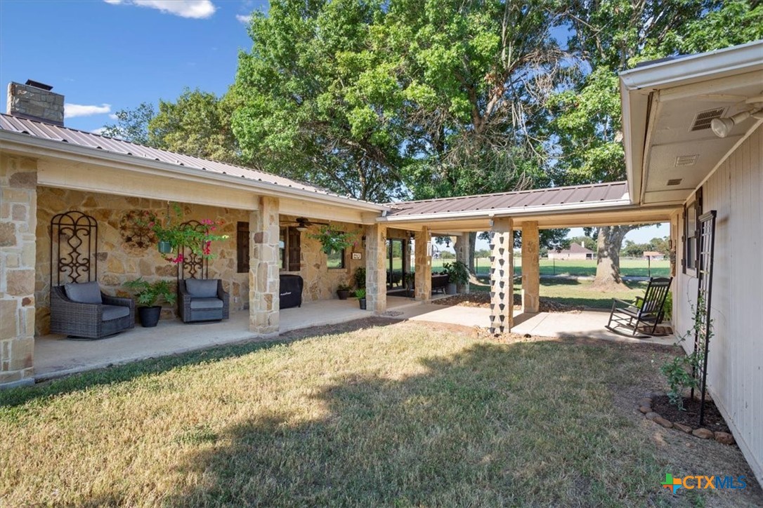 6409 3 Forks Road Belton, TX 76513 - Photo 35 of 40 a view of a house with backyard porch and sitting area