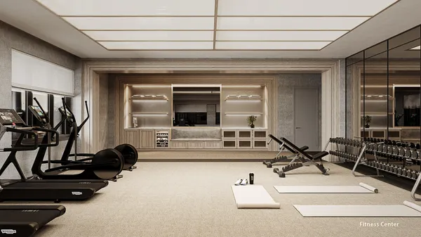 a living room with furniture gym equipment and a large window