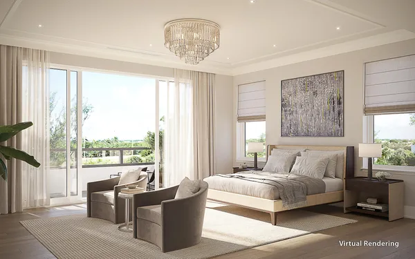a bedroom with a large bed and a chandelier