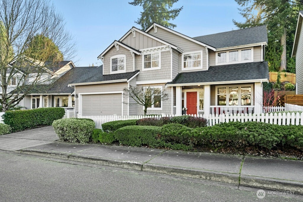 1807 Northeast 26th Place Renton, WA 98056 - Photo 1 of 38 front view of a house next to a yard