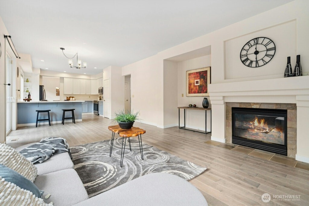 1807 Northeast 26th Place Renton, WA 98056 - Photo 12 of 38 a living room with furniture and a fireplace