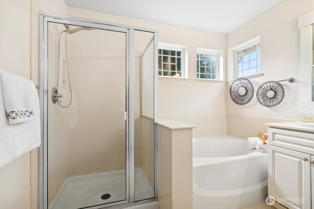 1807 Northeast 26th Place Renton, WA 98056 - Photo 24 of 38 a bathroom with a bathtub a shower a toilet and a sink