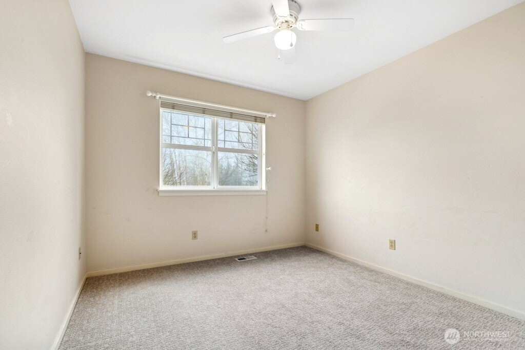 1807 Northeast 26th Place Renton, WA 98056 - Photo 30 of 38 an empty room with a window