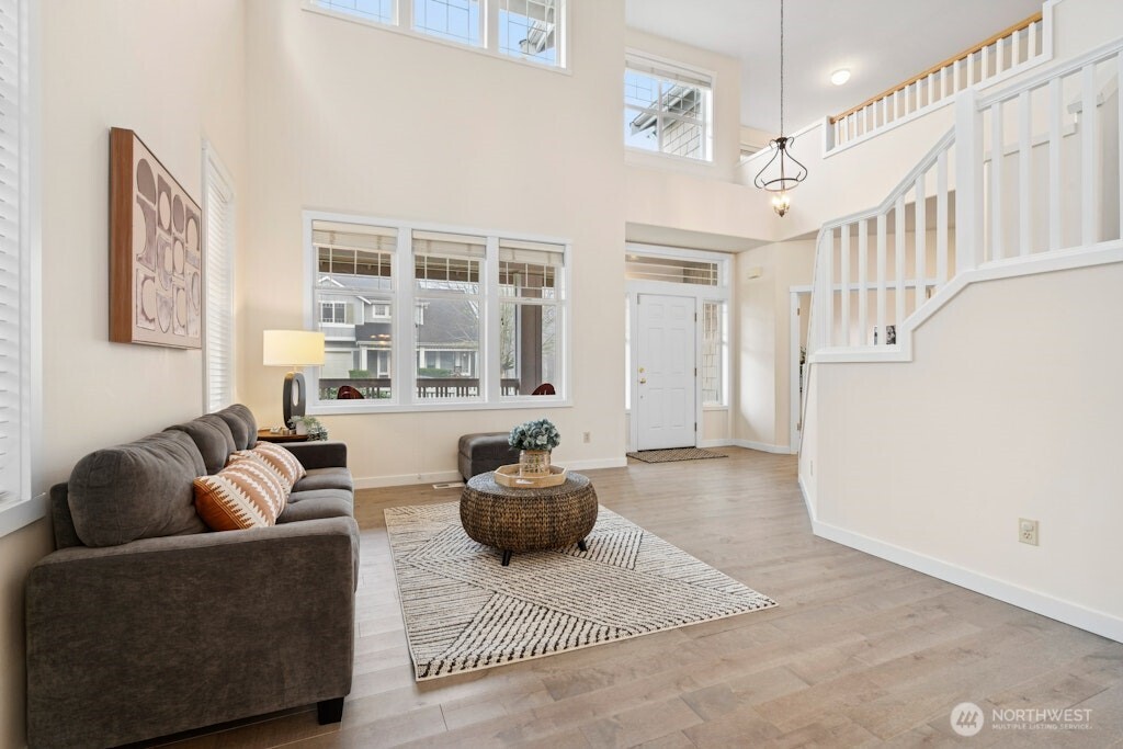 1807 Northeast 26th Place Renton, WA 98056 - Photo 8 of 38 a living room with furniture and a rug