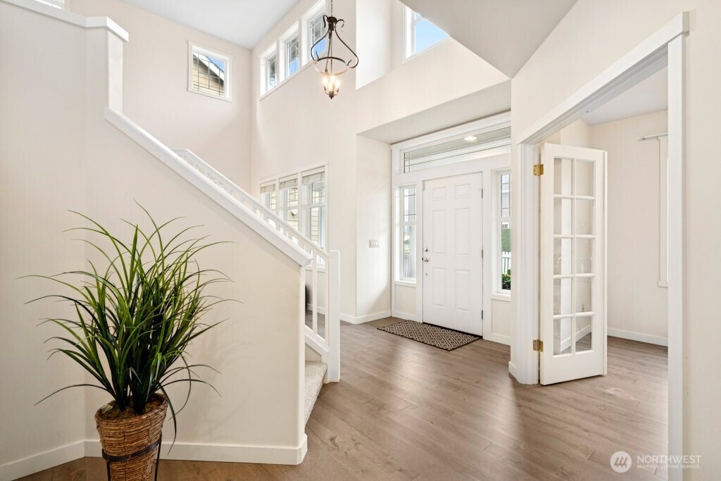 1807 Northeast 26th Place Renton, WA 98056 - Photo 9 of 38 a view interior of a house with wooden floor and windows