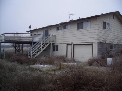 241 Liberty Road Granger, WA 98932 - Photo 2 of 6 a front view of a house with plants