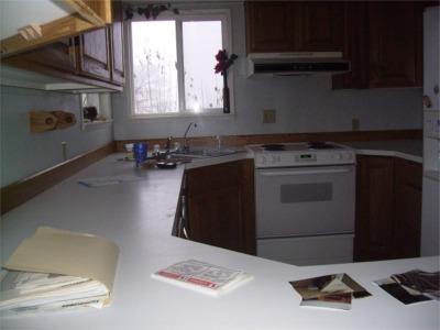 241 Liberty Road Granger, WA 98932 - Photo 4 of 6 a kitchen with a stove and a cabinet