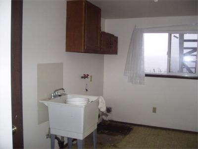 241 Liberty Road Granger, WA 98932 - Photo 6 of 6 a bathroom with a sink and a window