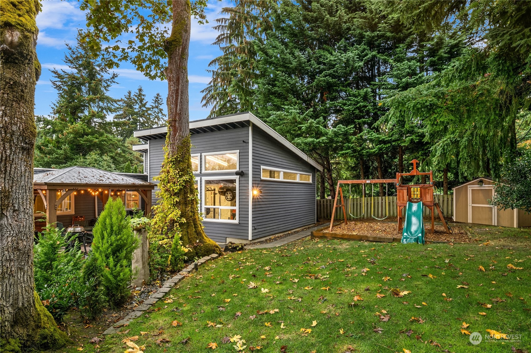 20 Cascade Key Bellevue, WA 98006 - Photo 29 of 38 a view of a wooden house with a small yard and large trees