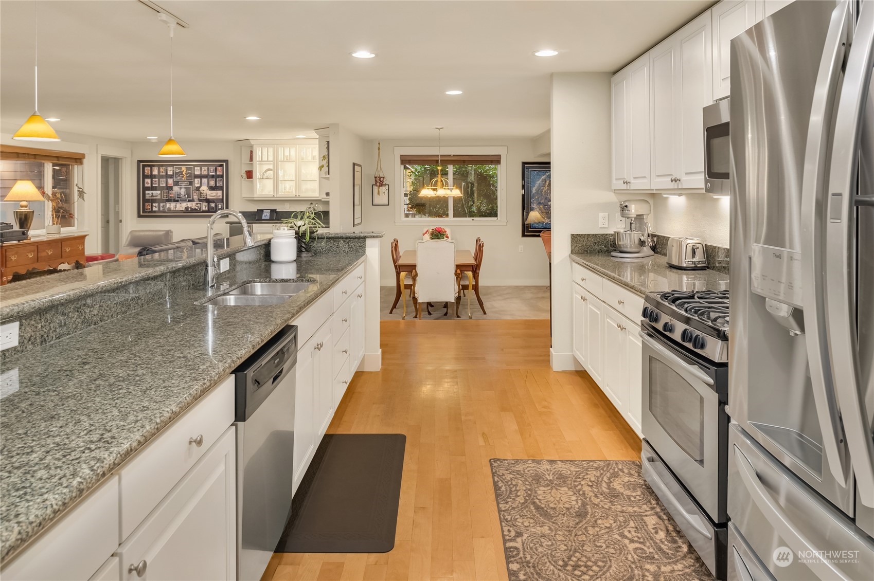 20 Cascade Key Bellevue, WA 98006 - Photo 6 of 38 a large kitchen with stainless steel appliances granite countertop a lot of counter space and wooden floor