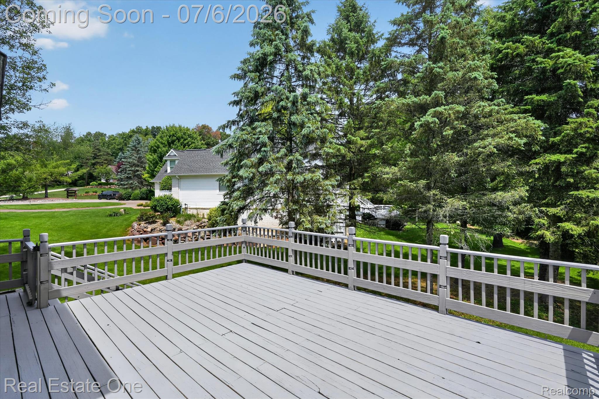 9610 Forest Ridge Drive Clarkston, MI 48348 - Photo 23 of 77 Expansive back deck with stairs to the backyard is perfect for any gathering.